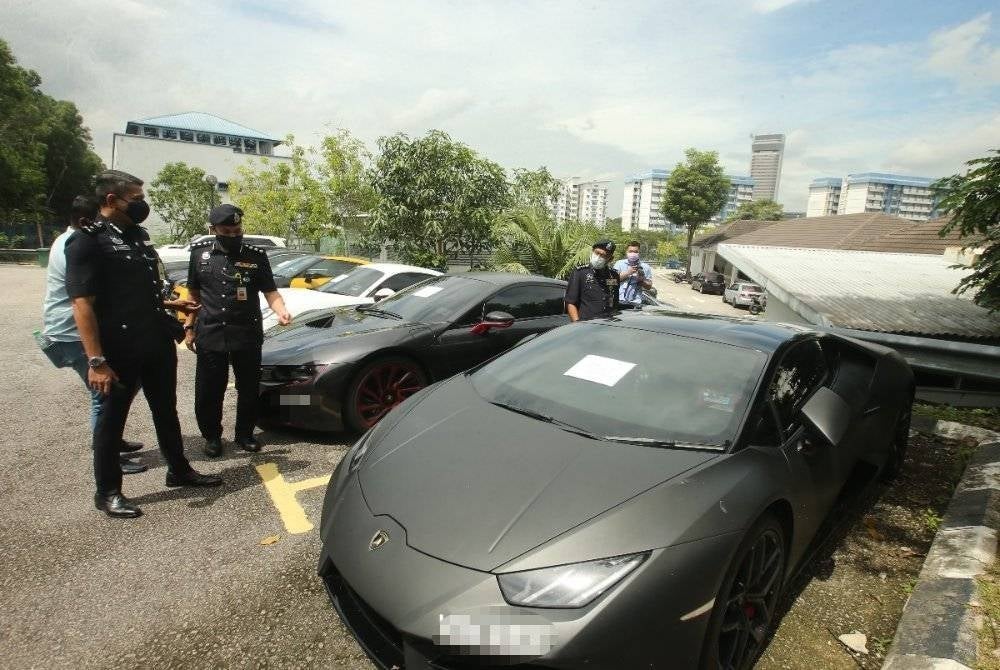 Police seized a Lamborghini supercar in Rawang, Selangor last August in connection to money laundering activities. Photo: SINAR HARIAN