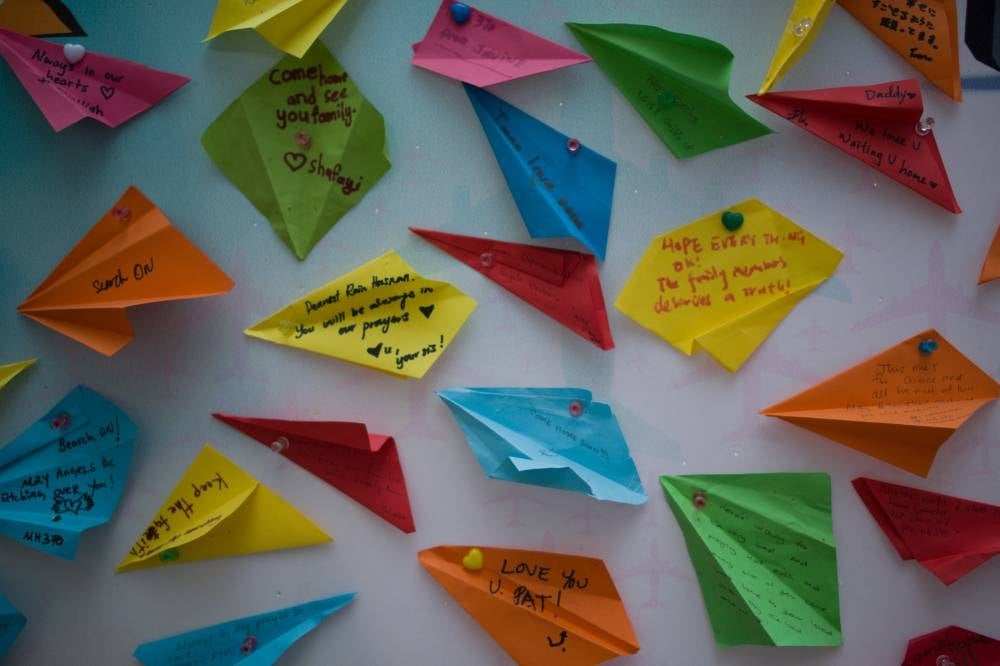 Messages from loved ones to unaccounted for family members are seen on display during a memorial event ahead of the fifth anniversary of the missing Malaysia Airlines flight MH370, in Kuala Lumpur on March 3, 2019. - Photo: AFP