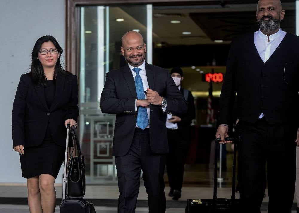 Former chief executive officer of 1MDB Arul Kanda Kandasamy (middle) at the Kuala Lumpur Courts Complex as a witness in the trial over the tampering of the 1MDB final audit report. - BERNAMA