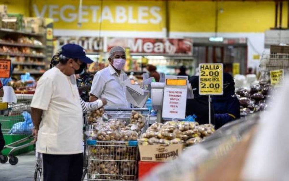 People shopping at the supermarket. - Photo: BERNAMA
