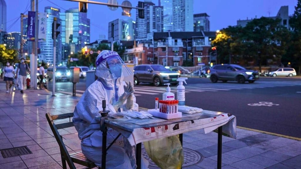  Health authorities reported over 300 infections Wednesday, with clusters found in the historic northern city of Xi'an as well as the country's biggest city Shanghai. - Photo by Hector Retamal / AFP