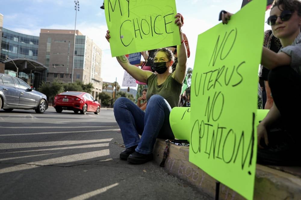 Abortion rights protesters chant during a Pro Choice rally at the Tucson Federal Courthouse in Tucson, Arizona on Monday, July 4, 2022. - (Photo by SANDY HUFFAKER / AFP)