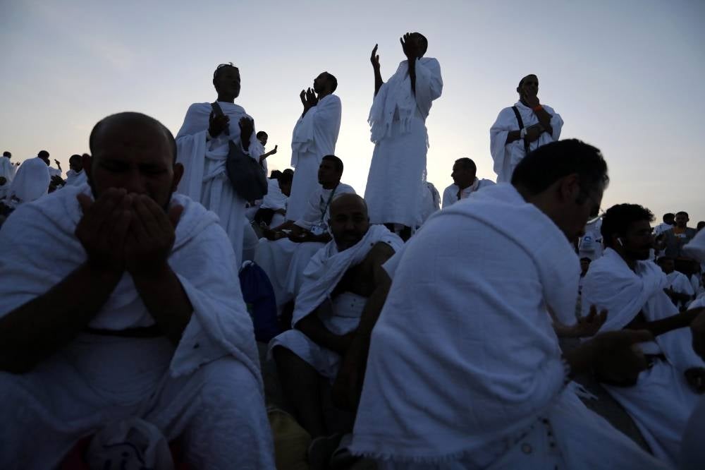 Muslim Hajj pilgrims pray as they gather at Mount Arafat during the annual hajj pilgrimage, southeast of Mecca, Saudi Arabia, July 8, 2022. (Photo by EPA/ASHRAF AMRA)