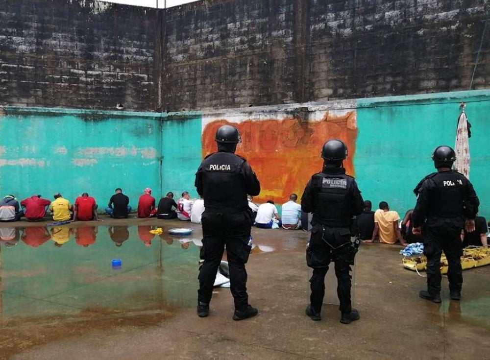 Handout photo released by the Ecuadorean Police of a police operation at the Bellavista prison in Santo Domingo de los Colorados, Ecuador, on May 11, 2022. - AFP