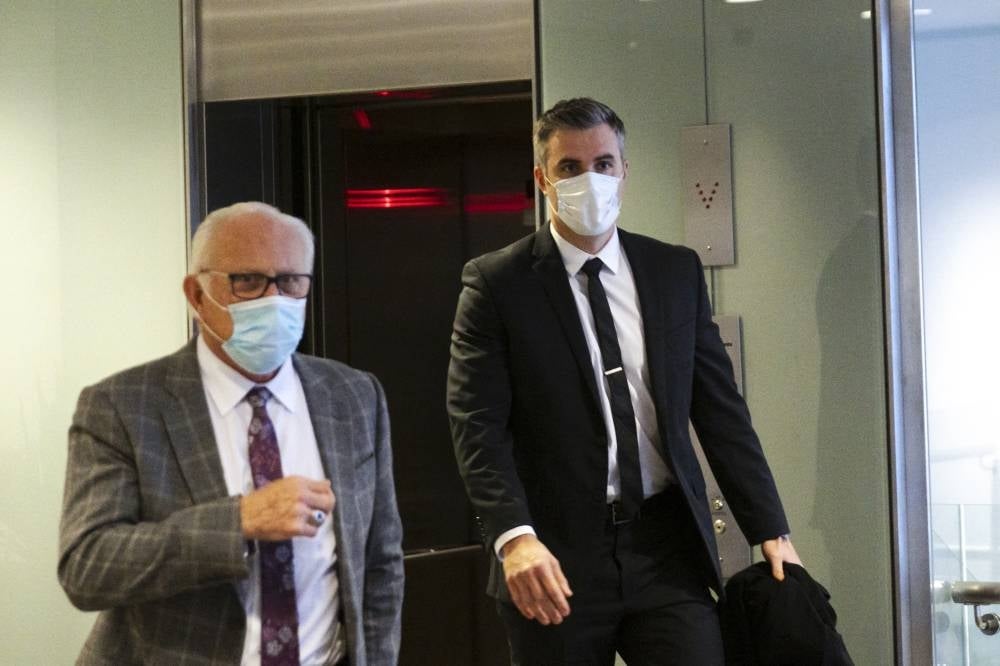 Former Minneapolis police officer Thomas Lane (R) and his attorney Earl Gray leave the US District Court in St. Paul, Minnesota, on Jan 11, 2022, after his pre-trial hearing along with two other former Minneapolis police officers charged with federal civil rights violations in George Floyd's death. (Photo by Kerem Yucel / AFP)