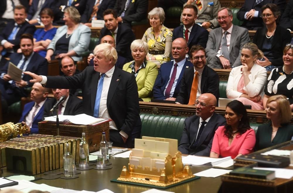 A handout photograph released by the UK Parliament shows Britain's Prime Minister Boris Johnson speaking during his final Prime Minister's Questions (PMQs) at the House of Commons in London on July 20, 2022. - AFP