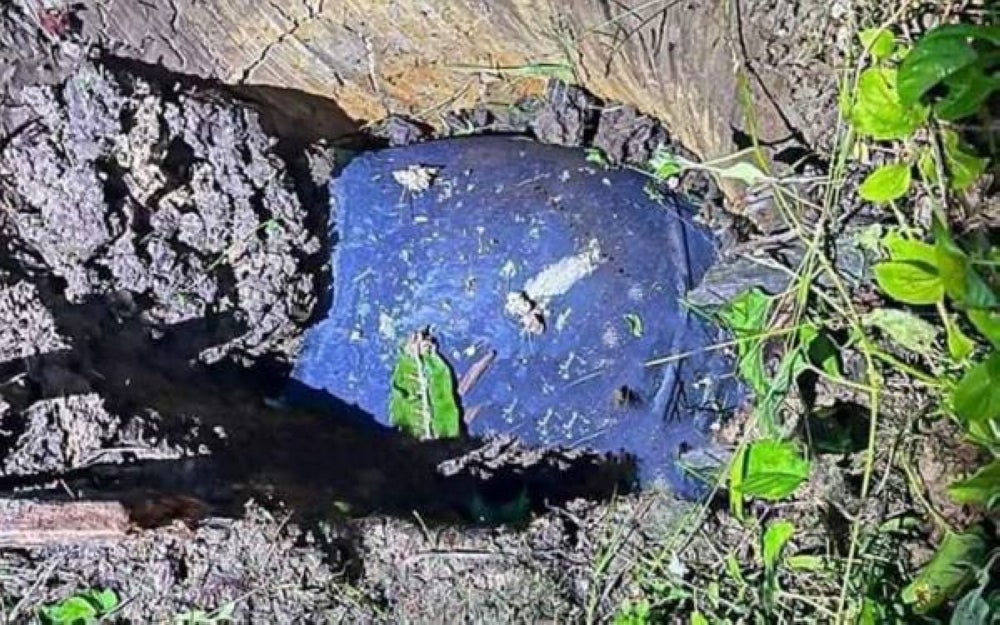 The metal debris was found lodged into the ground. Photo by FB Info Terkini Sarawak.