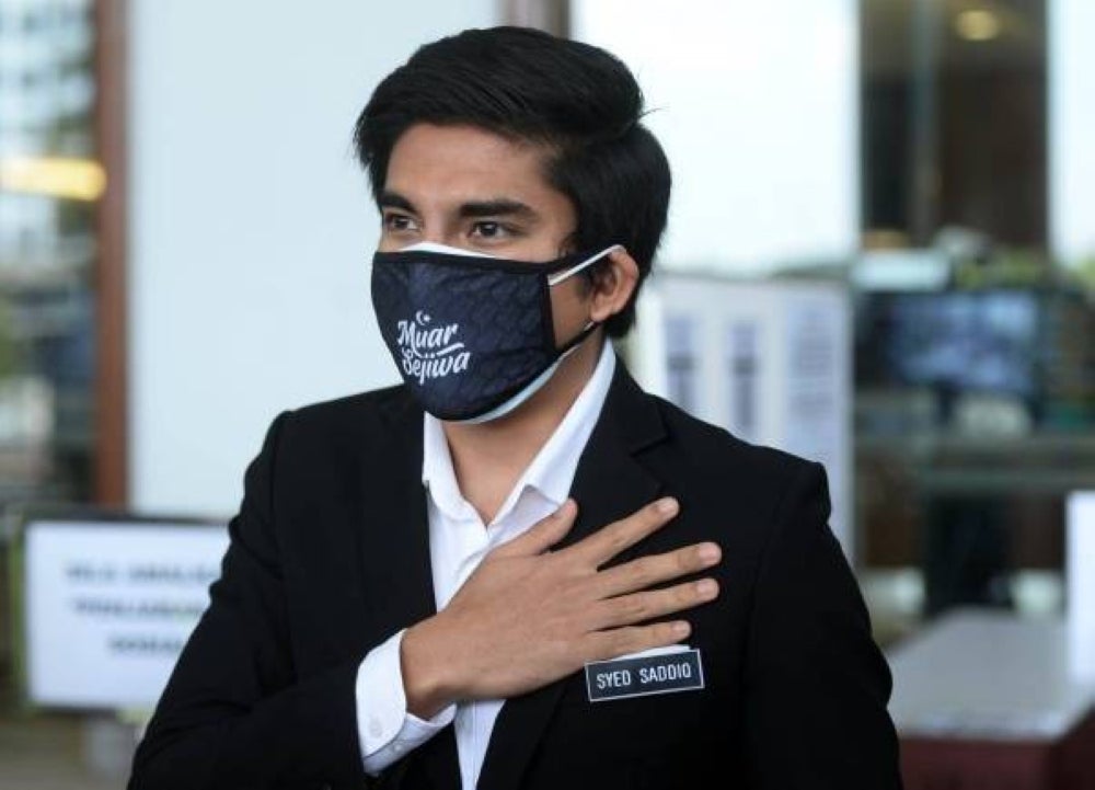Asbi Munip, 32, said this was because the money laundering case investigation was focused on the transfer of RM100,000 from Syed Saddiq’s (left) personal Maybank account to his Amanah Saham Bumiputera (ASB) account.
