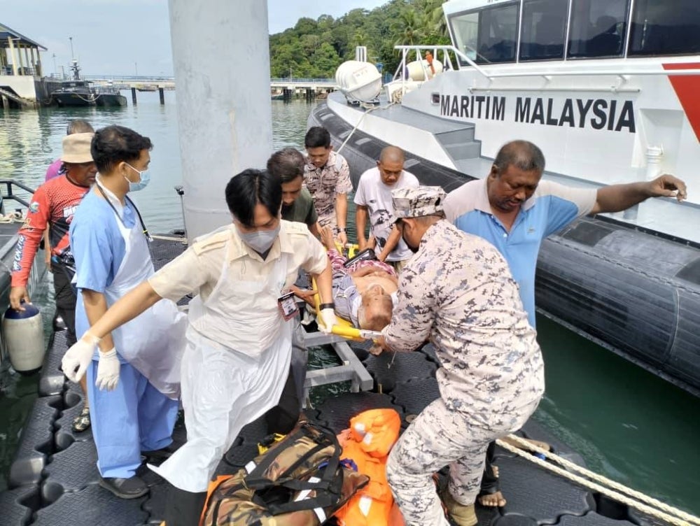 The boat was reported to have sunk at 6pm yesterday due to bad weather. - Photo by Maritim Malaysia Kedah