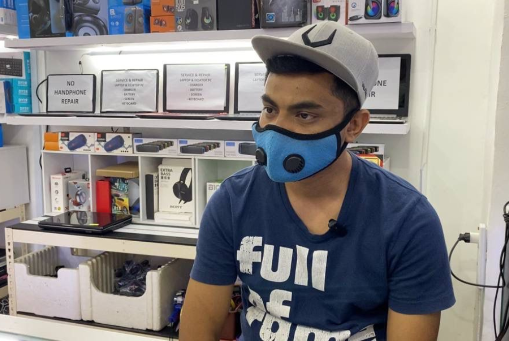 Trader Azmil Asrop says business is slow but surviving