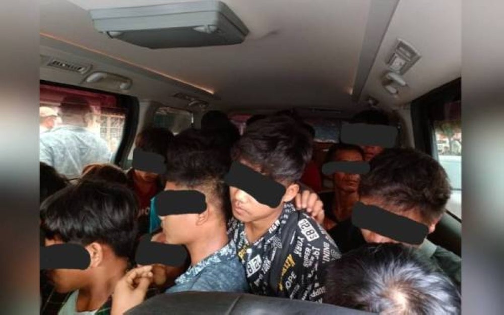 The smuggles of 25 Myanmar migrants in a Toyota Vellfire vehicle earlier this month. - PDRM Photo