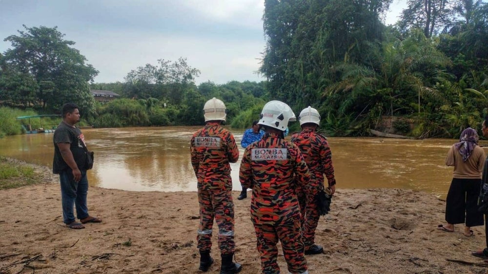 The victims had been swimming in the river with several other friends when they were swept away at about 3.30 pm on Tuesday.  - JBPM Photo