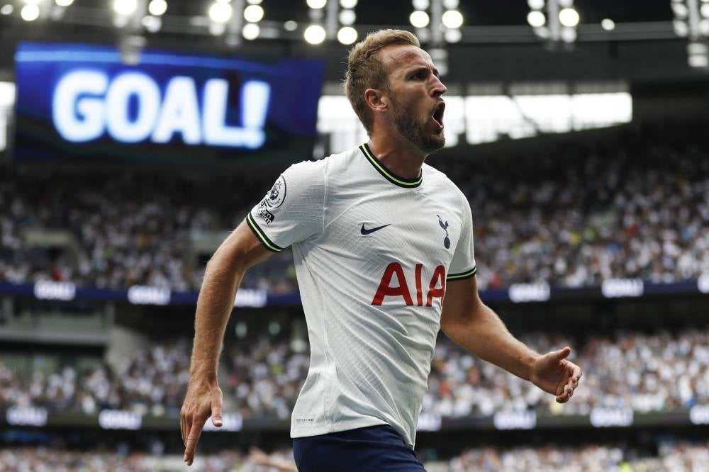 Tottenham Hotspur's English striker Harry Kane celebrates after he scores the first goal during the English Premier League football match between Tottenham Hotspur and Wolverhampton Wanderers at Tottenham Hotspur Stadium in London, on Aug 20, 2022. (Photo by Ian Kington / AFP) 