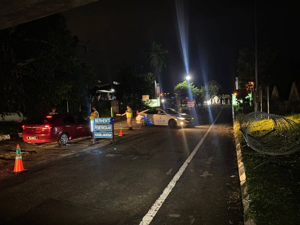 Police earlier set up barbed wire near the entrance.