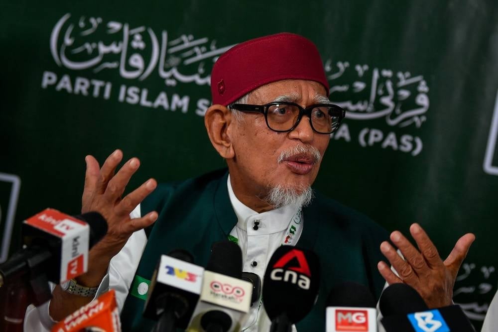 Hadi during a press conference after he officiated the 68th PAS Annual Meeting today. Photo: BERNAMA