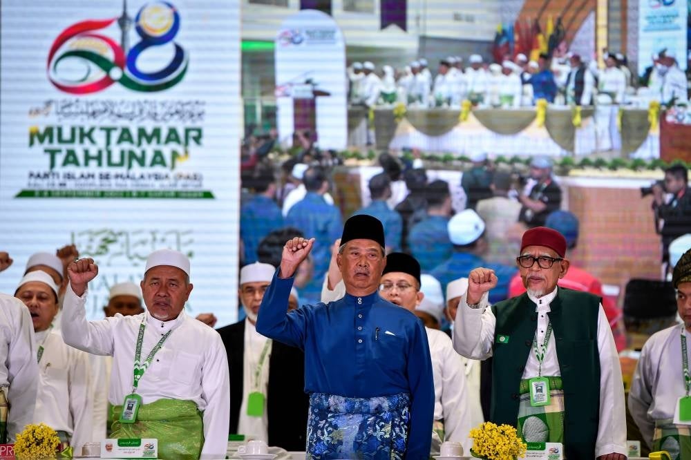 Hadi and Muhyiddin at the PAS 68th Annual Meeting. Photo: BERNAMA