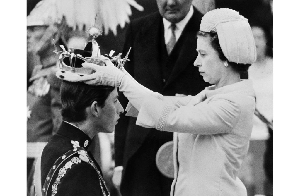 In this file photo taken on July 01, 1969 Queen Elizabeth II puts a crown on his son Prince Charles during his investiture as new Prince of Wales in Caernarfon. (AFP)