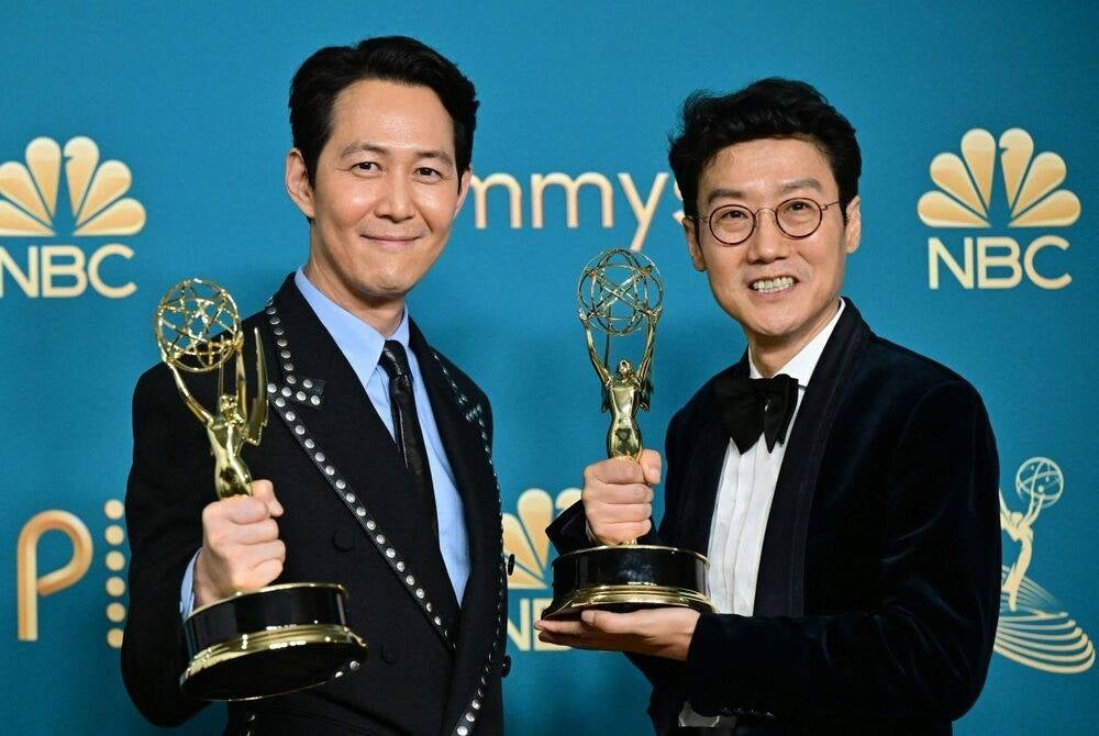 South Korean actor Lee Jung Jae (left) and director Hwang Dong Hyuk (right) pose with their Emmy Awards - AFP Photo