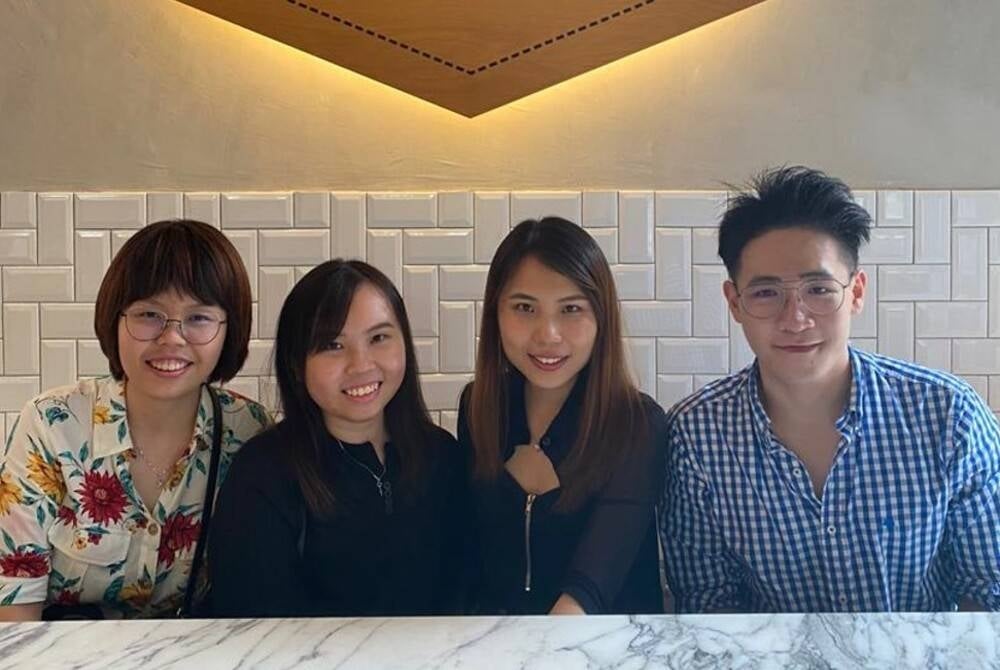 Puah Boon Peng (right) posing with friends during pre-Covid days - Photo courtesy of Puah Boon Peng