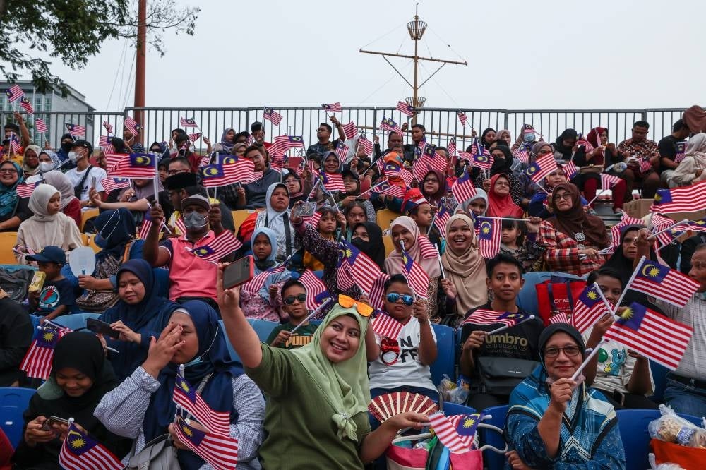 Visitors at Dataran Merdeka during the Malaysia Day celebration, today. - BERNAMA
