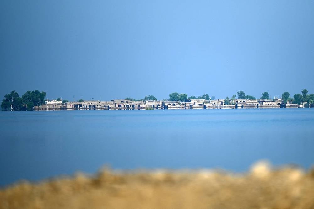 A general view of flooded houses in Mehar city after heavy monsoon rains in Dadu district, Sindh province on Sept 9, 2022. - (Photo by AAMIR QURESHI / AFP)