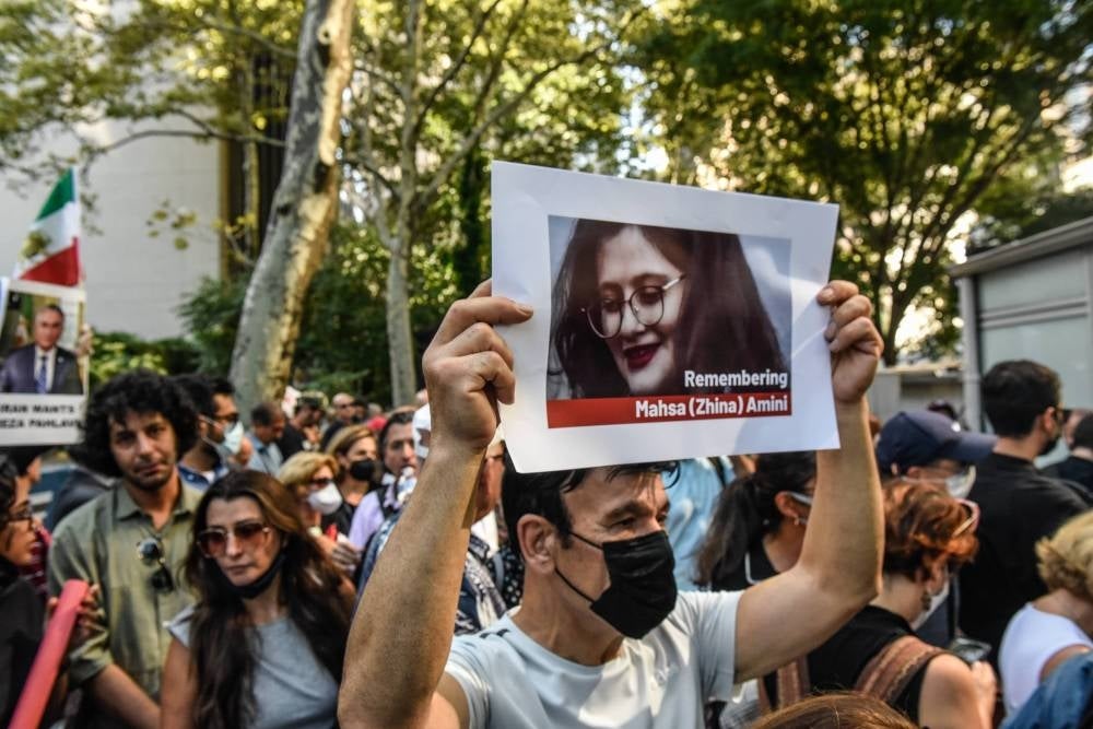 Protests broke out over the death of 22-year-old Iranian woman Mahsa Amini, who died in police custody for allegedly violating the country's hijab rules. Amini's death has sparked protests across Iran and other countries. Stephanie Keith/Getty Images/AFP