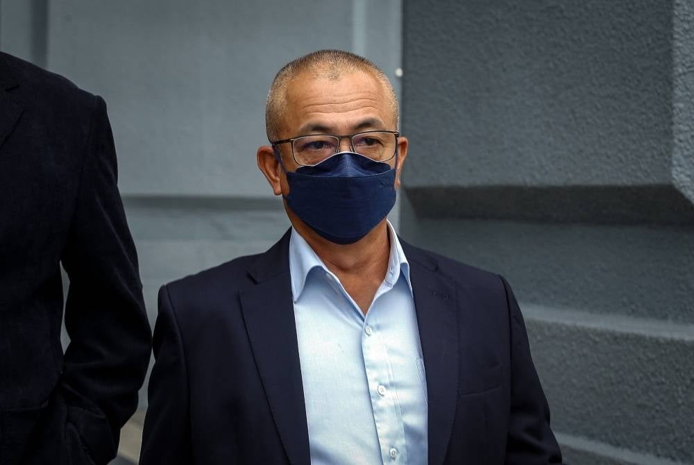 Rozman is charged as an official of a public body, the Deputy Chairman of the Labuan Port Authority, to have used his position to obtain gratification. - Bernama Photo