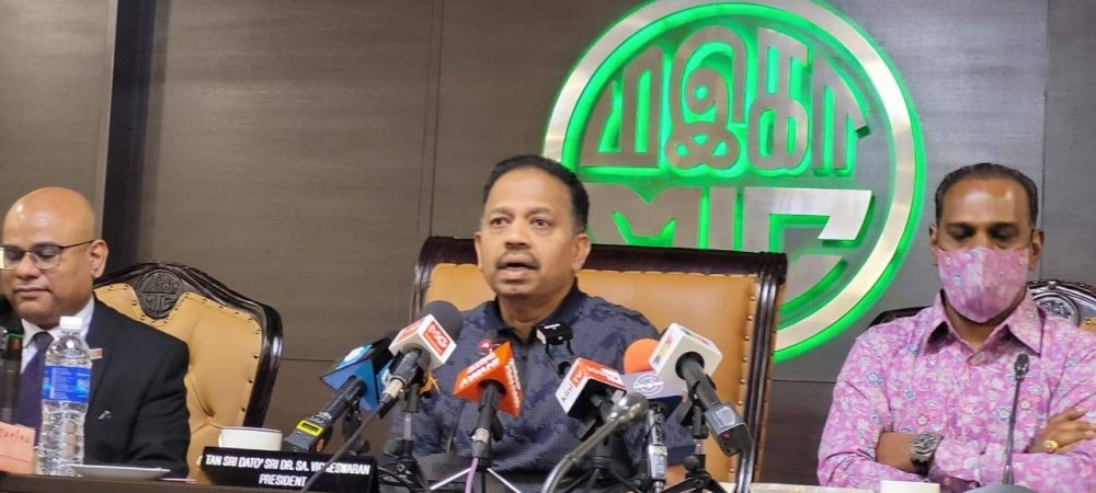 MIC President Tan Sri SA Vigneshwaran (middle) and his deputy M Saravanan