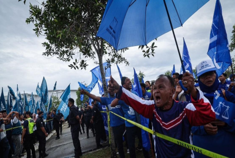 Supporters of a party at one of the nomination centres - BERNAMA