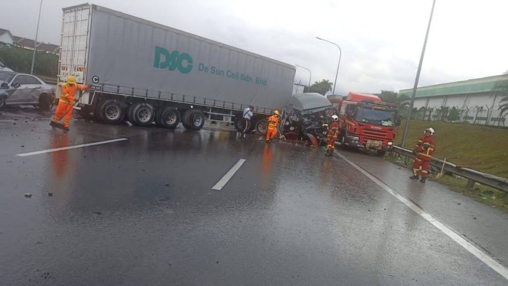 The situation at the scene of the six-vehicle crash at KM 280 North-South Expressway southbound near Nilai on Friday. - (Photo of Negeri Sembilan Fire and Rescue Department)