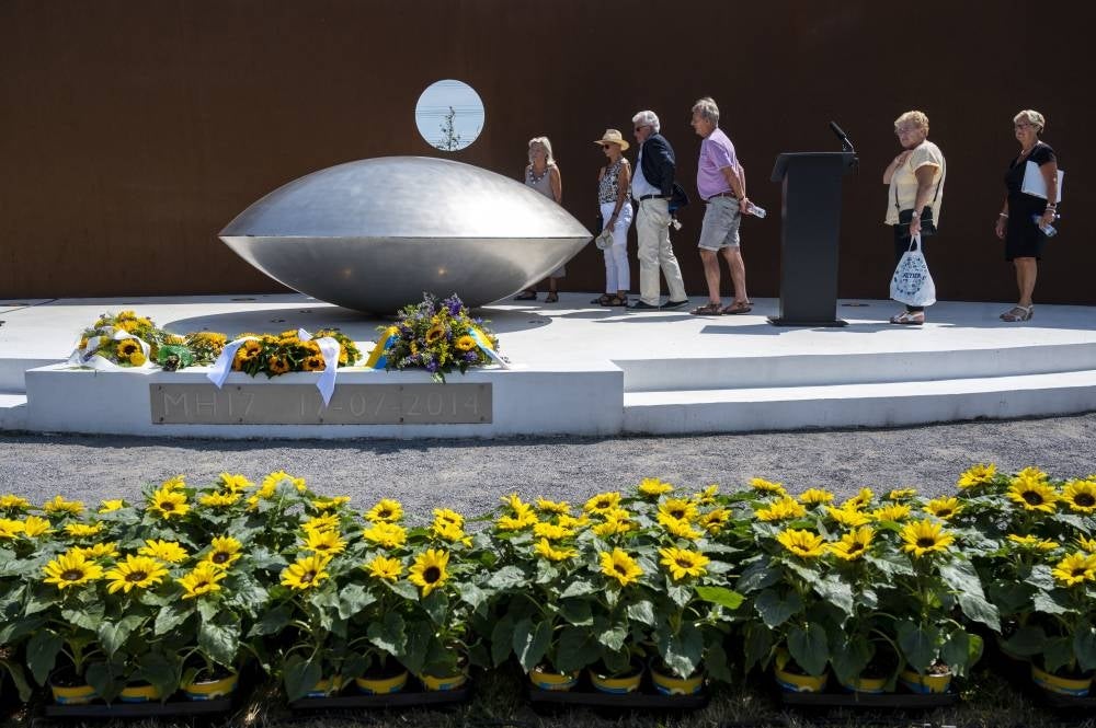 Relatives attend a commemoration at the National Monument MH17 in Park Vijfhuizen near Amsterdam on July 17, 2022. Photo by Evert Elzinga/AFP