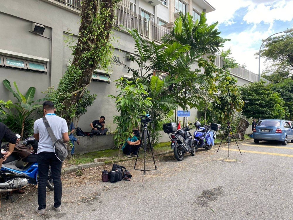 Media personnel at the vicinity of Muhyiddin's house to follow developments after GE15 on Sunday.