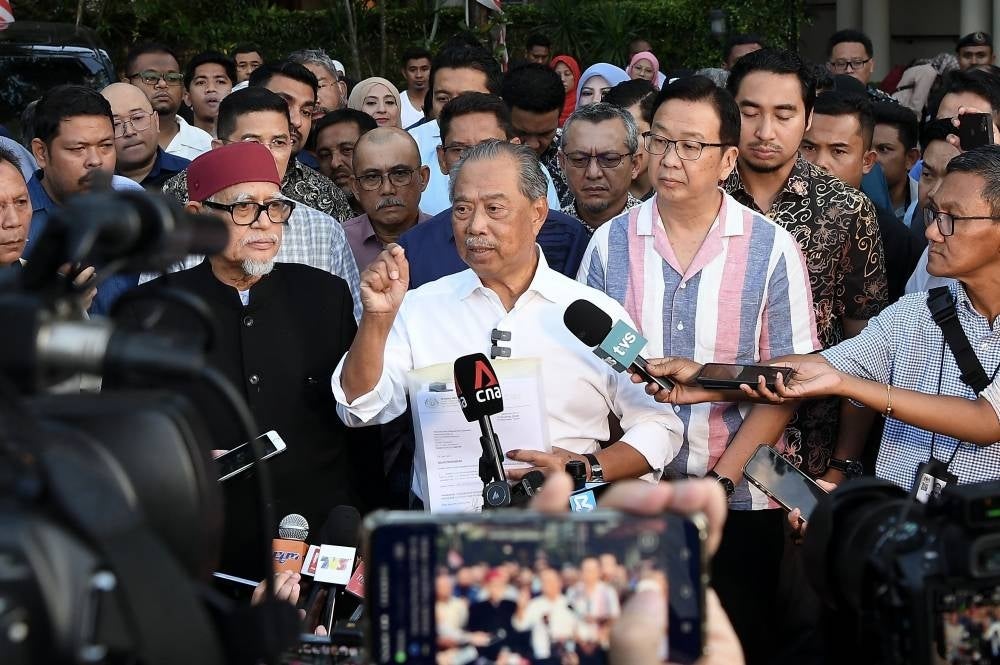 Perikatan Nasional ChairmanTan Sri Muhyiddin Yassin (centre) during today's presser after arriving home from the Istana Negara. (Photo by BERNAMA)