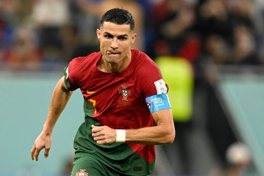 Portugal's forward #07 Cristiano Ronaldo celebrates scoring his team's second goal from a penalty shot during the Qatar 2022 World Cup Group H football match between Portugal and Ghana. (Photo by PATRICIA DE MELO MOREIRA / AFP)
