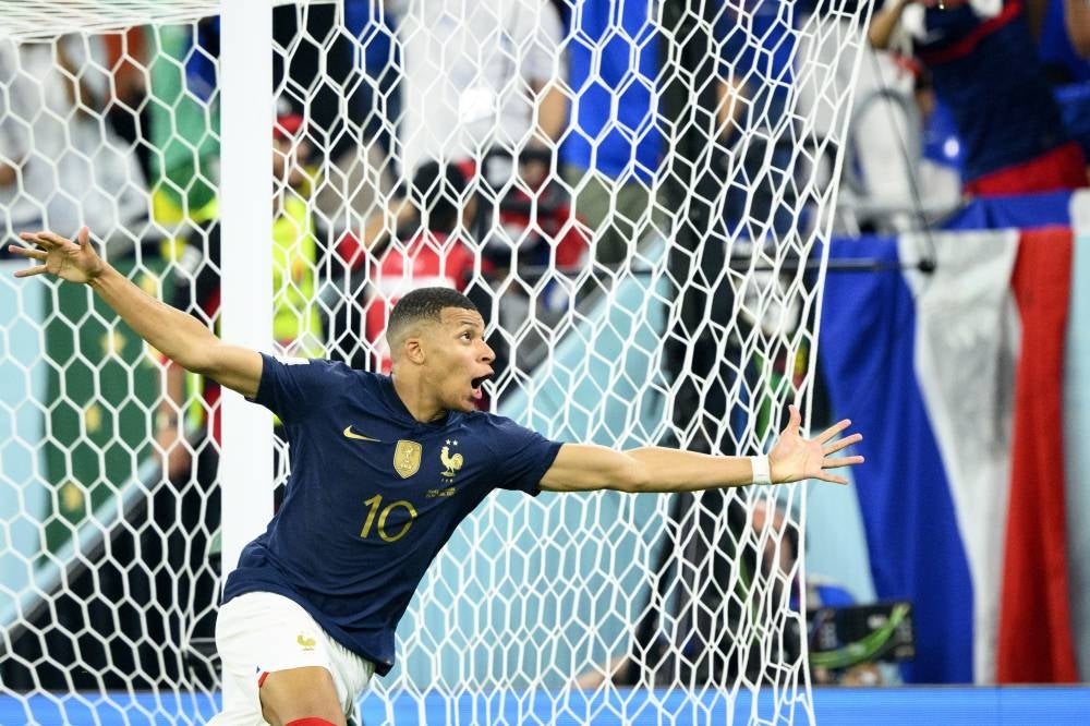 Kylian Mbappe of France celebrates after scoring his second goal during the FIFA World Cup 2022 group D soccer match between France and Denmark at Stadium 947 in Doha, Qatar, 26 November 2022. (Photo by EPA/LAURENT GILLIERON)