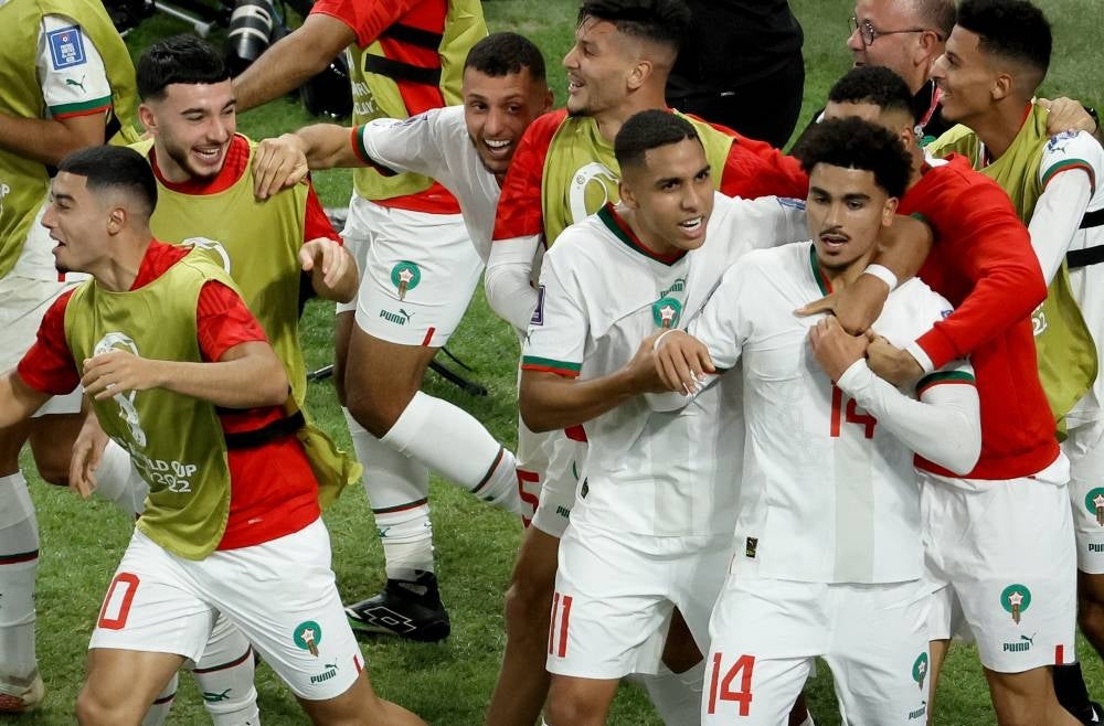 Zakaria Aboukhlal of Morocco celebrates with teammates after scoring his team's second goal during the FIFA World Cup 2022 group F soccer match between Belgium and Morocco at Al Thumama Stadium in Doha, Qatar, 27 November 2022. (Photo by EPA/Ronald Wittek)