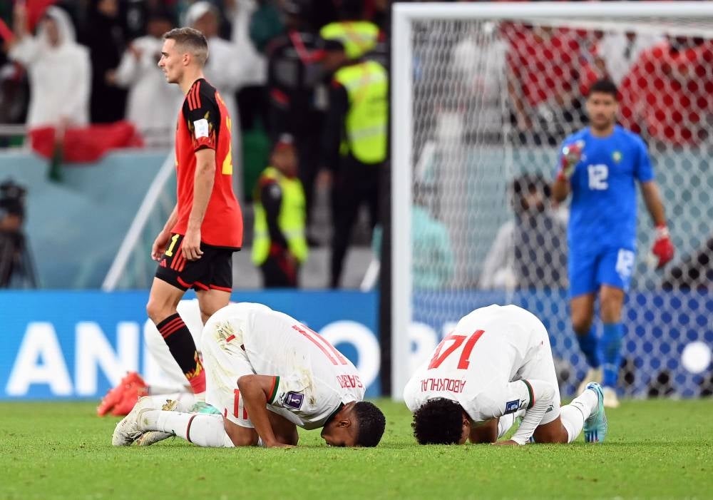 Morocco's goal scorers Abdelhamid Sabiri (L) and Zakaria Aboukhlal (R) react after winning the FIFA World Cup 2022 group F soccer match between Belgium and Morocco at Al Thumama Stadium in Doha, Qatar, 27 November 2022. (Photo by EPA/Georgi Licovski)