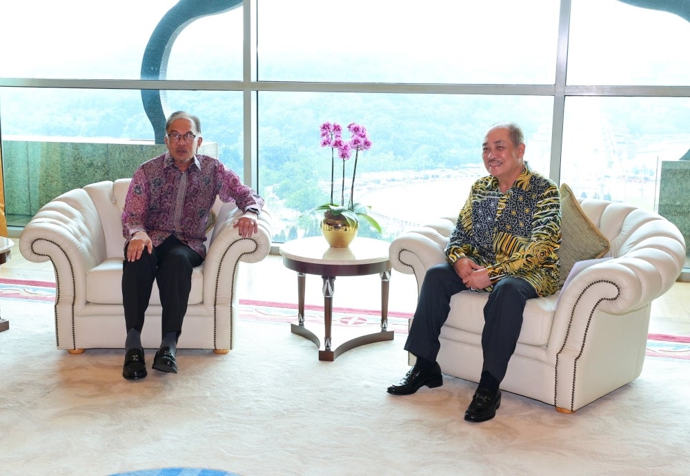 Anwar (left) with Hajiji at Prime Minister's department