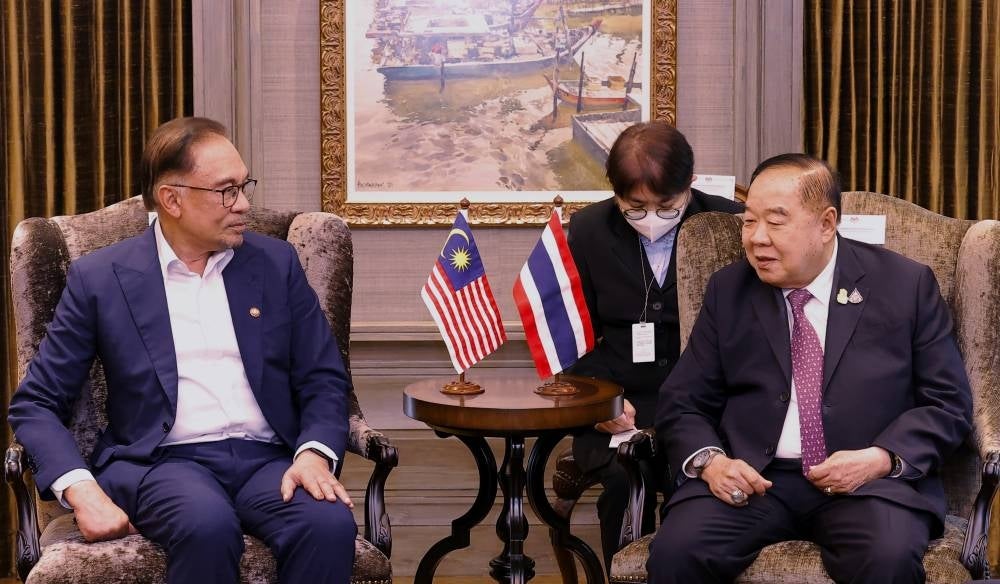 Prime Minister Datuk Seri Anwar Ibrahim (left) receives a courtesy call from Thailand Deputy Prime Minister General Prawit Wongsuwan at his official residence in Seri Perdana, today. Photo - BERNAMA