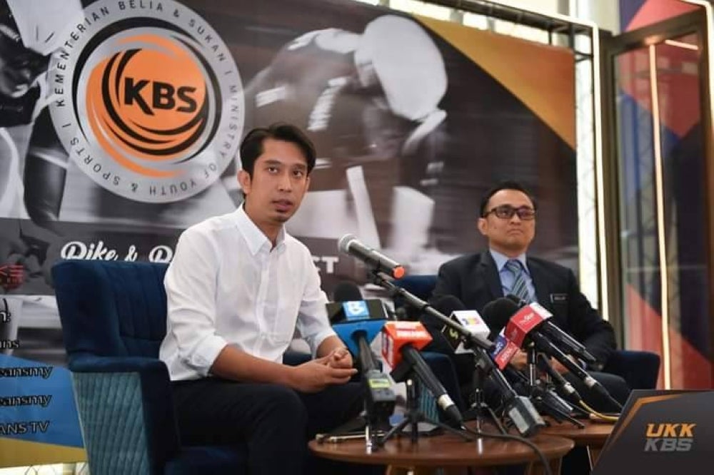 Adam Adli (left) on his forst day at work as youth and sports deputy minister - Facebook KBS pic