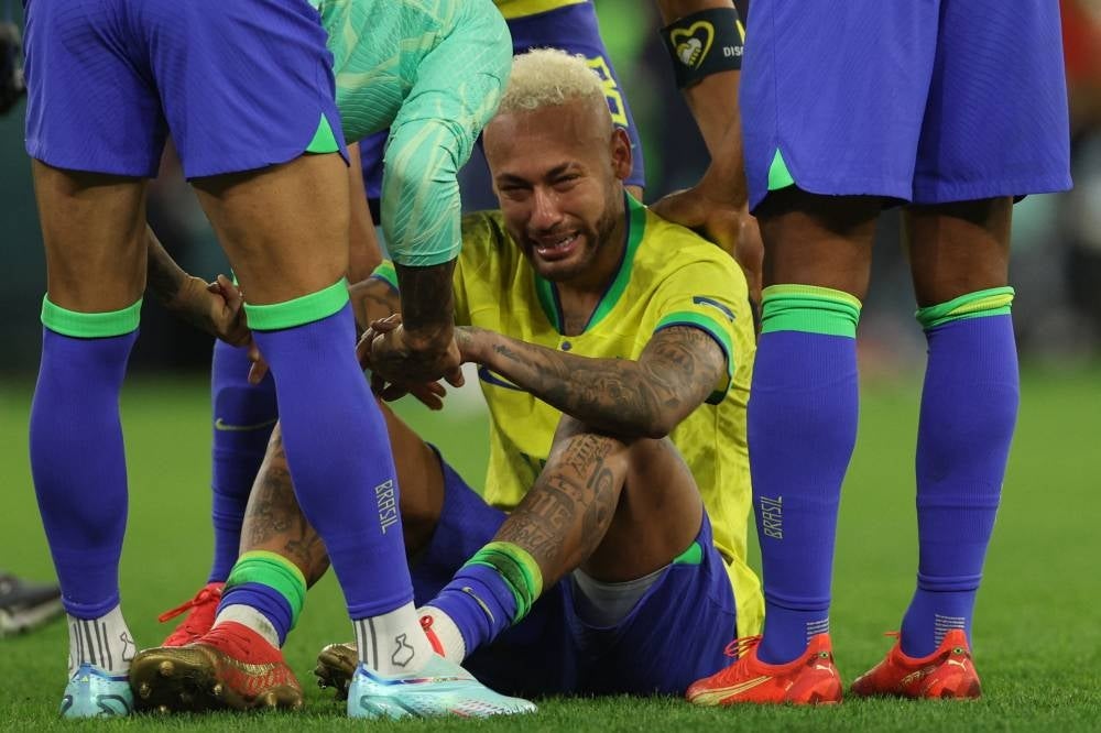 Brazil's forward #10 Neymar reacts after his team lost the Qatar 2022 World Cup quarter-final football match between Croatia and Brazil at Education City Stadium in Al-Rayyan, west of Doha, on Dec 9, 2022. (Photo by Adrian DENNIS / AFP)