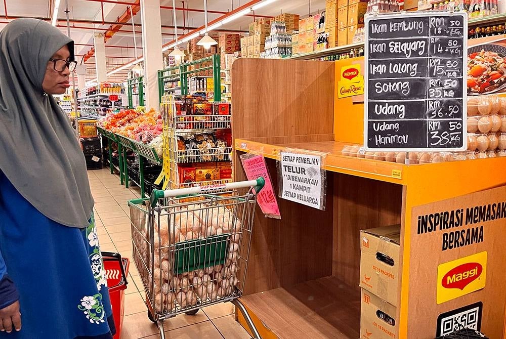 Some customers choose imported eggs at a supermarking in Pasir Puteh, Kelantan due to the current shortage of local eggs.