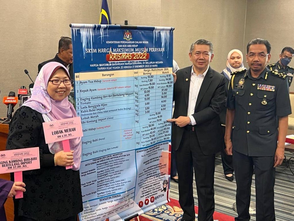 Domestic Trade and Cost of Living Minister Datuk Seri Salahuddin Ayub showing the list of controlled price items ahead of the Christmas celebrations.