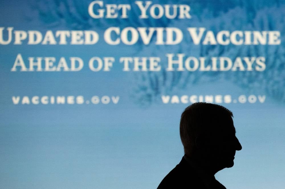 Dr. Anthony Fauci, White House Chief Medical Advisor and Director of the National Institute of Allergy and Infectious Diseases, attends an event with First Lady Jill Biden to urge Americans to get vaccinated ahead of the holiday season, during a COVID-19 virtual event with AARP in the Eisenhower Executive Office Building in Washington, DC, December 9, 2022. (Photo by SAUL LOEB / AFP)