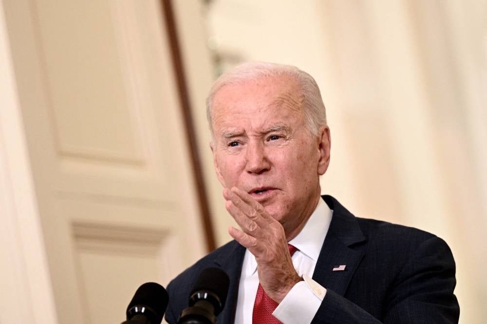 US President Joe Biden delivers a Christmas address from the Cross Hall of the White House in Washington, DC, on December 22, 2022. (Photo by Brendan SMIALOWSKI / AFP)