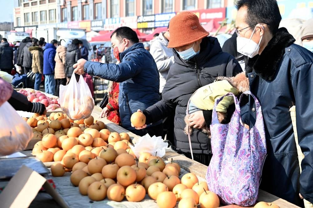 Chinese citizens carrying out daily activities - AFP pic