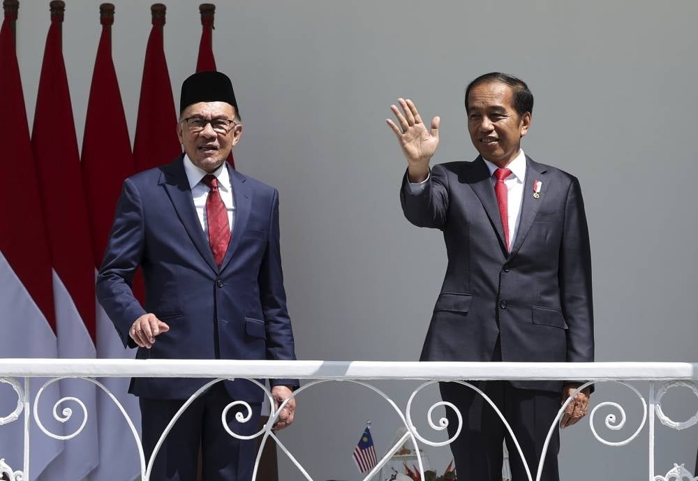 Prime Minister Datuk Seri Anwar Ibrahim (left) with Indonesian President Joko Widodo on the veranda of Bogor Presidential Palace before their bilateral meeting on Monday. - BERNAMA
