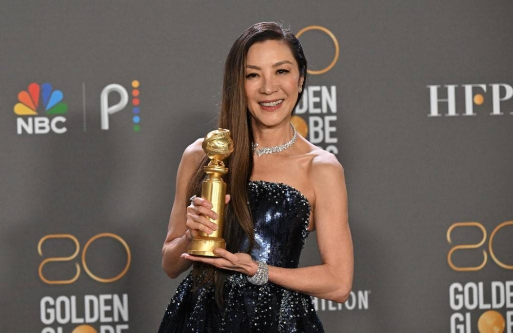 Malaysian actress Michelle Yeoh poses with the award for Best Actress - Motion Picture - Musical/Comedy for "Everything Everywhere All at Once" in the press room during the 80th annual Golden Globe Awards at The Beverly Hilton hotel in Beverly Hills, California, on January 10, 2023. (Photo by Frederic J. Brown / AFP)