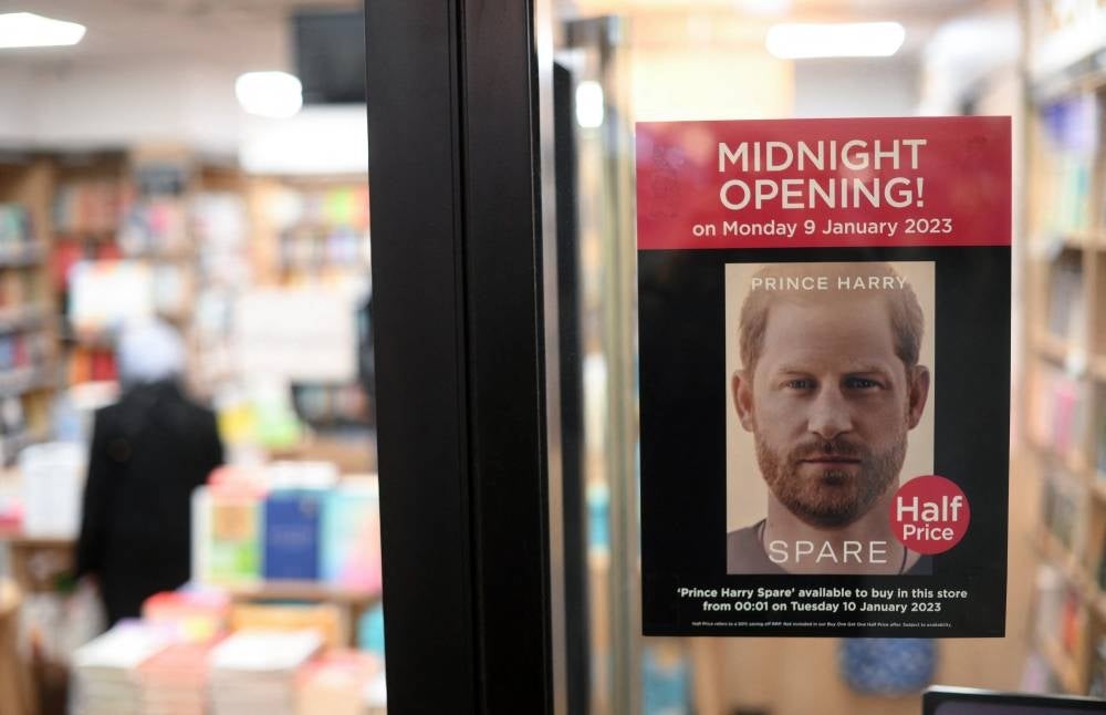 A poster advertising the publication of the book 'Spare' by Britain's Prince Harry, Duke of Sussex, is pictured in the window of a book store in London - AFP