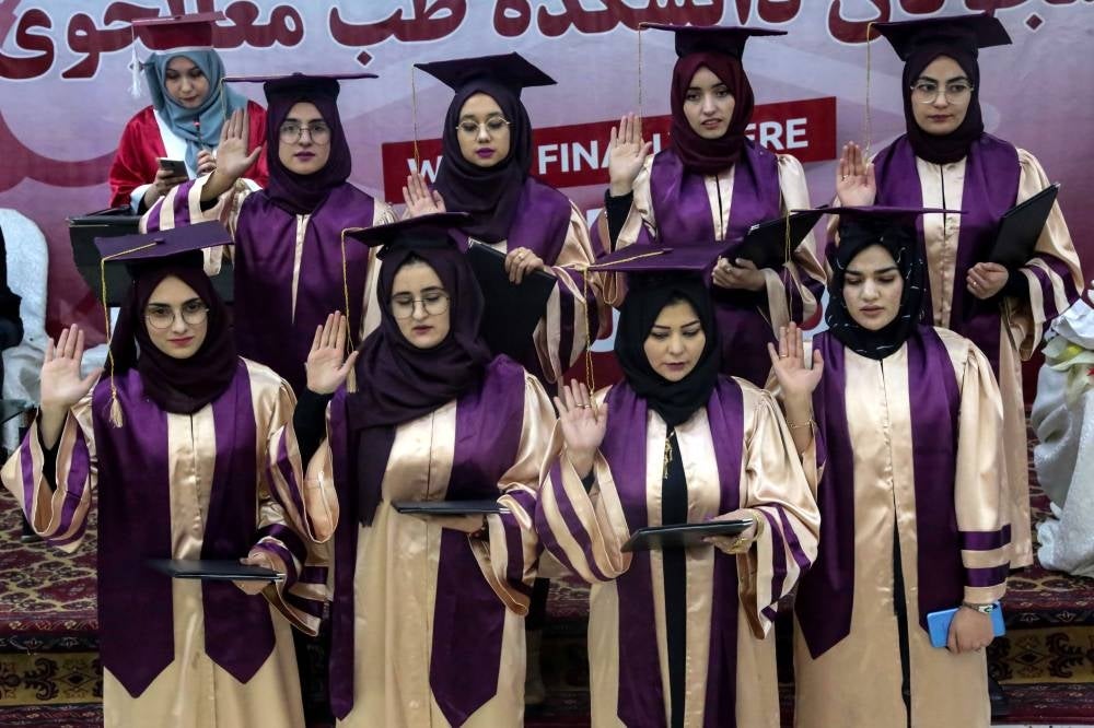Afghan girls from a private university celebrate their graduation in Kabul, Afghanistan, 04 January 2023. A group of 24 male and nine female students at a private university were graduated from the Faculty of Medicine on 04 January. The ruling Taliban has banned women from attending university in Afghanistan, according to an order issued on 20 December 2022. - EPA